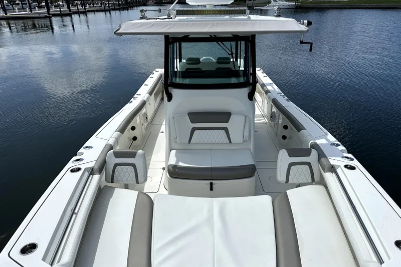 Slide: The Image of 2022 World Cat 325 CC boat with spacious seating on calm water. - 3