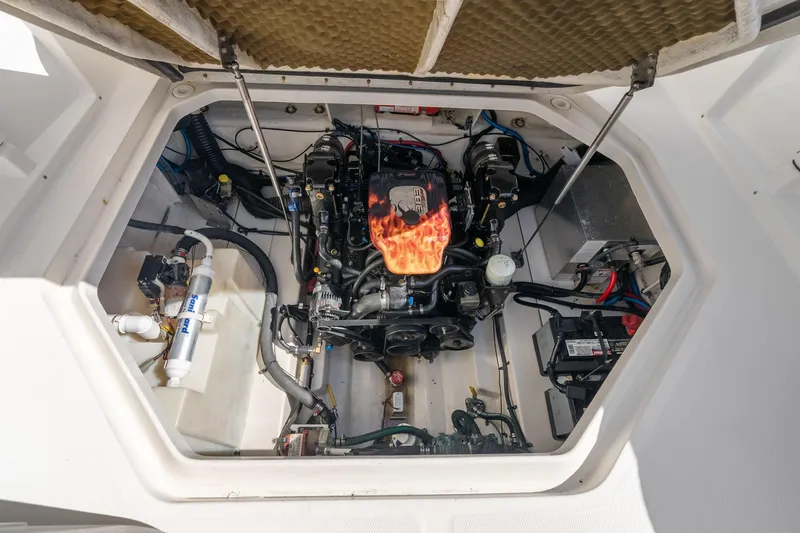 Slide: The Image of Engine compartment of a 2005 Sea Ray 270 Amberjack boat, showcasing detailed components. - 23