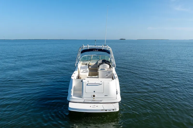 Slide: The Image of 2005 Sea Ray 270 Amberjack boat on calm blue water under clear sky. - 5