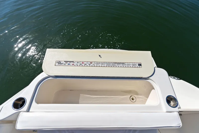 Slide: The Image of 2005 Sea Ray 270 Amberjack boat with open storage compartment on deck. - 15