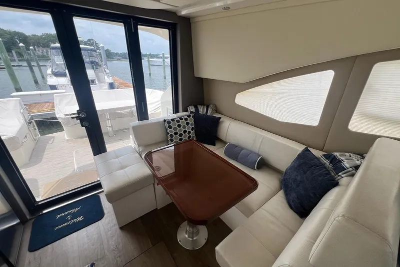 Slide: The Image of Luxurious interior of 2019 Carver C37 yacht with elegant seating and table. - 27