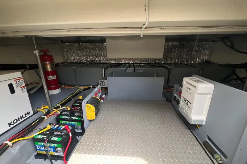 Slide: The Image of Engine room of 2019 Carver C37 yacht with Kohler generator and Interstate batteries. - 43