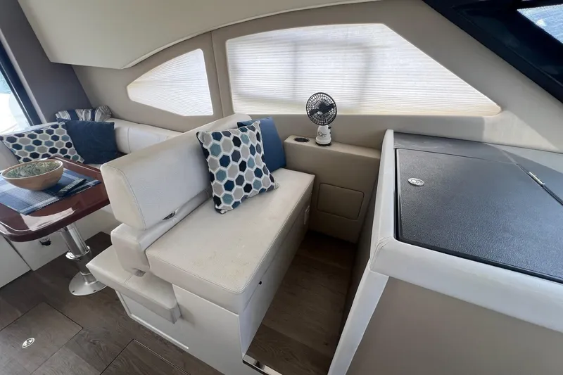 Slide: The Image of Interior of 2019 Carver C37 yacht with modern seating and decorative pillows. - 25