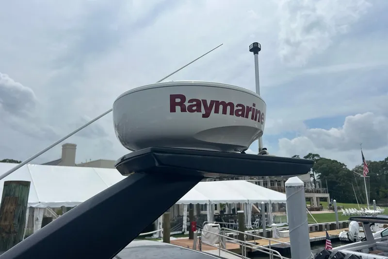Slide: The Image of Raymarine radar on 2019 Carver C37 yacht, docked with tents and flags in background. - 14