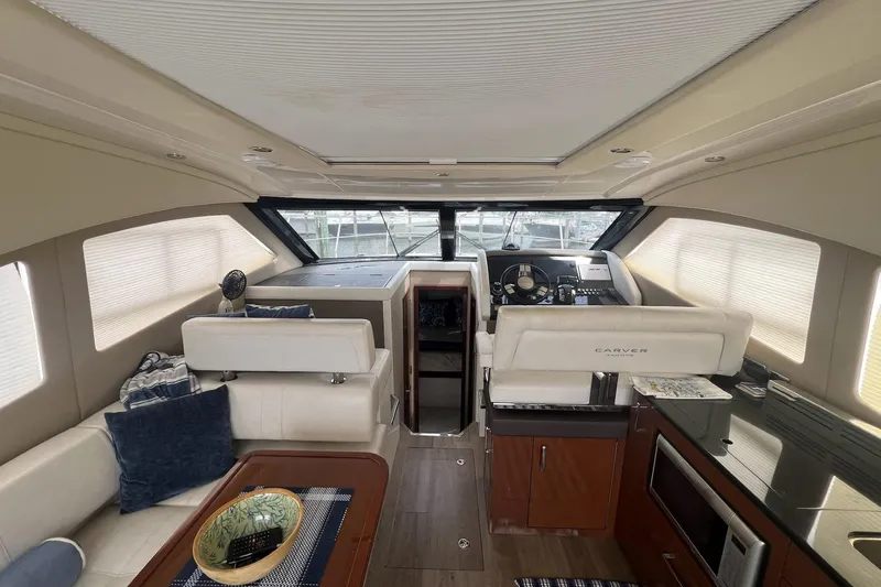 Slide: The Image of Interior of a 2019 Carver C37 yacht with modern helm and seating area. - 28