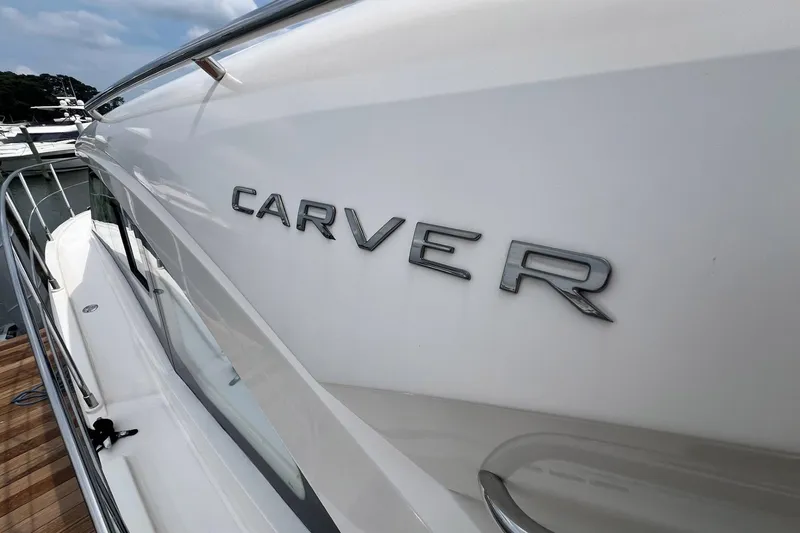 Slide: The Image of 2019 Carver C37 yacht side view with logo, docked at marina. - 9