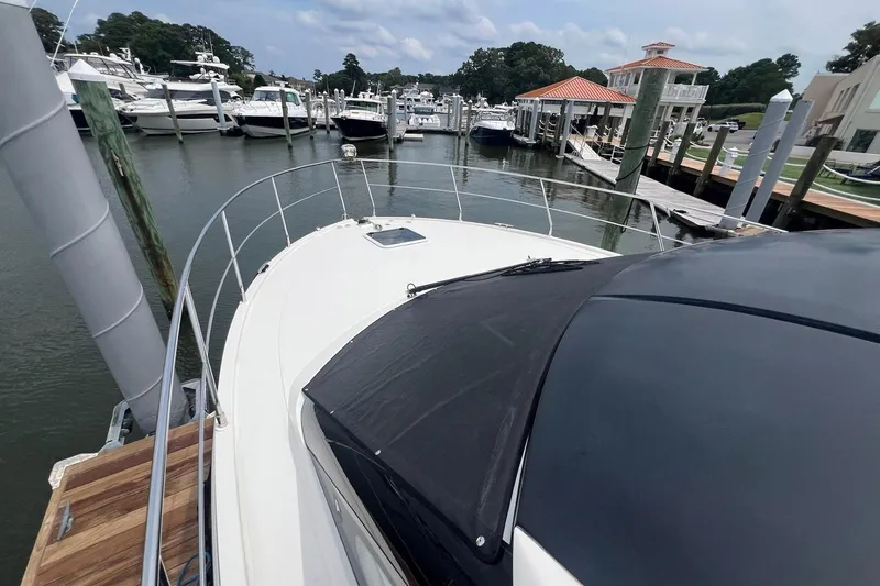 Slide: The Image of 2019 Carver C37 yacht docked at a marina with other boats. - 11
