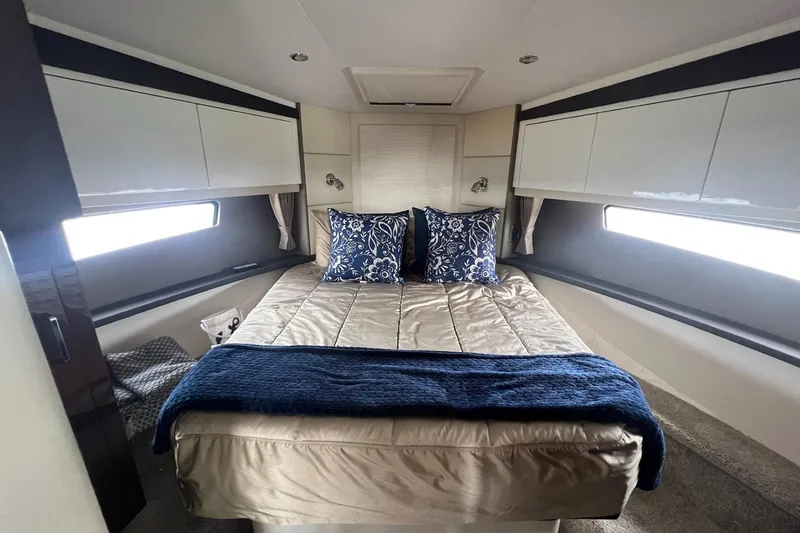 Slide: The Image of Luxurious 2019 Carver C37 yacht bedroom with elegant bedding and modern design. - 21