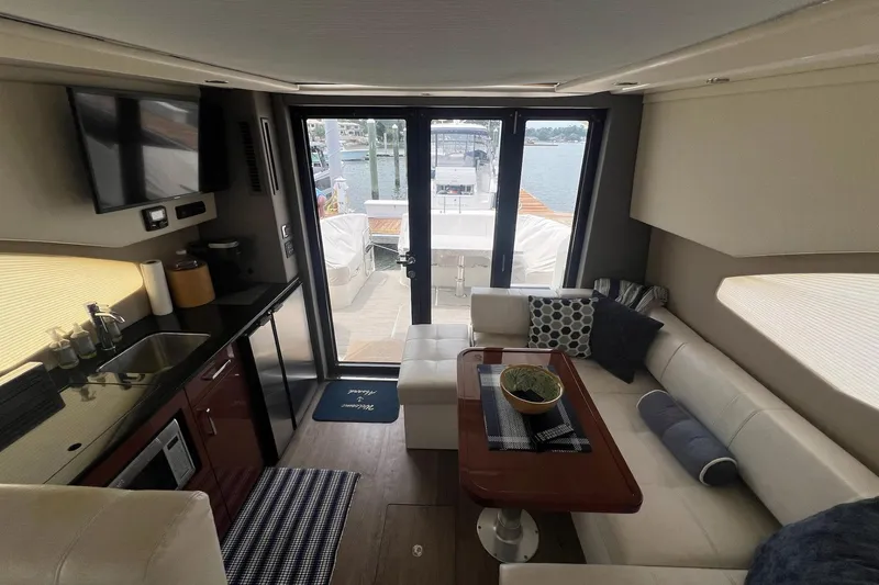 Slide: The Image of Luxurious interior of 2019 Carver C37 yacht with modern amenities and waterfront view. - 24