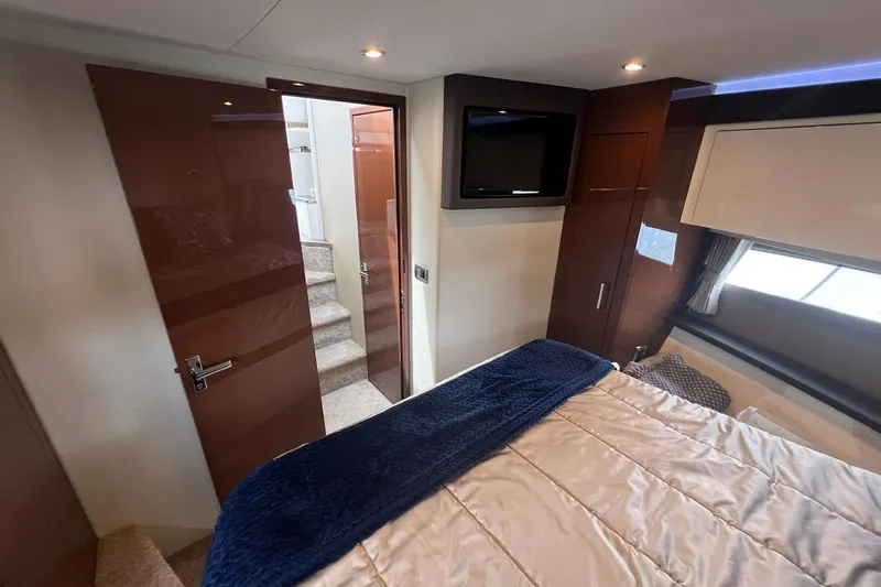 Slide: The Image of Luxurious interior of 2019 Carver C37 yacht bedroom with modern decor and cozy bedding. - 30