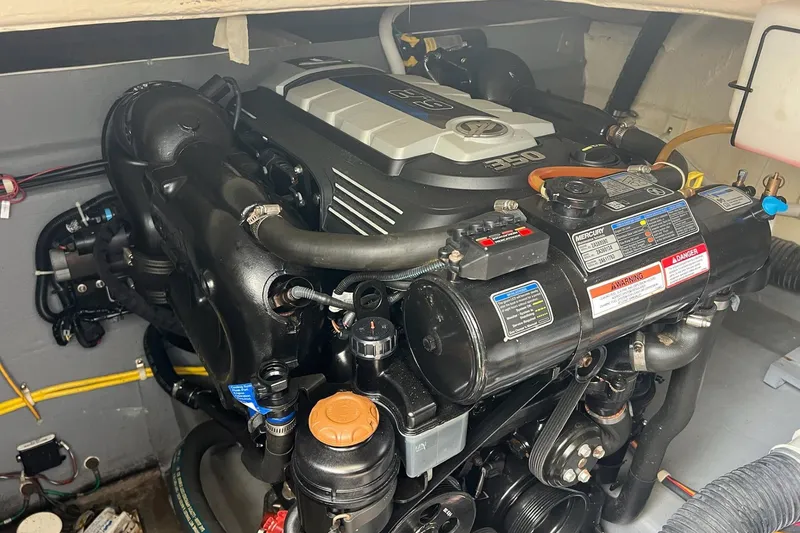 Slide: The Image of Engine compartment of a 2019 Carver C37, featuring a Mercury 350 engine. - 45