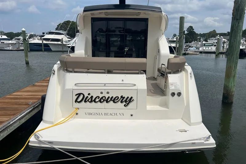 Slide: The Image of 2019 Carver C37 yacht named "Discovery" docked in Virginia Beach marina. - 5