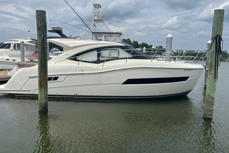 The Image of 2019 Carver C37 yacht docked at marina, side view. - 2