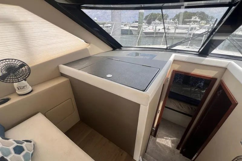 Slide: The Image of Interior of a 2019 Carver C37 yacht, featuring a cozy cabin and modern design. - 22