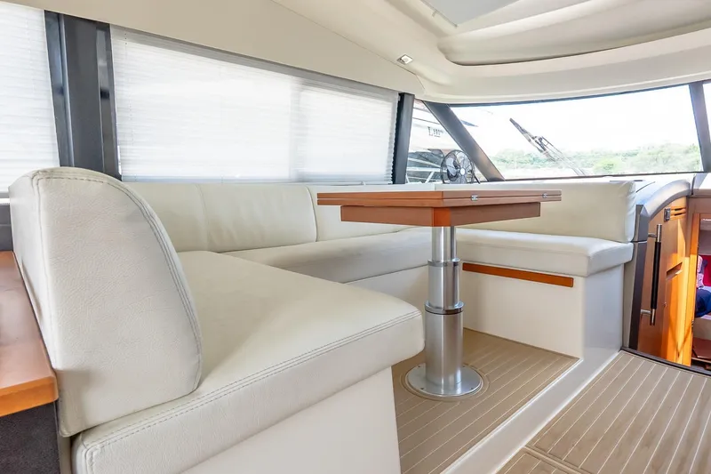 Slide: The Image of Luxurious interior of a 2015 Prestige 450S yacht with elegant seating and wooden table. - 11