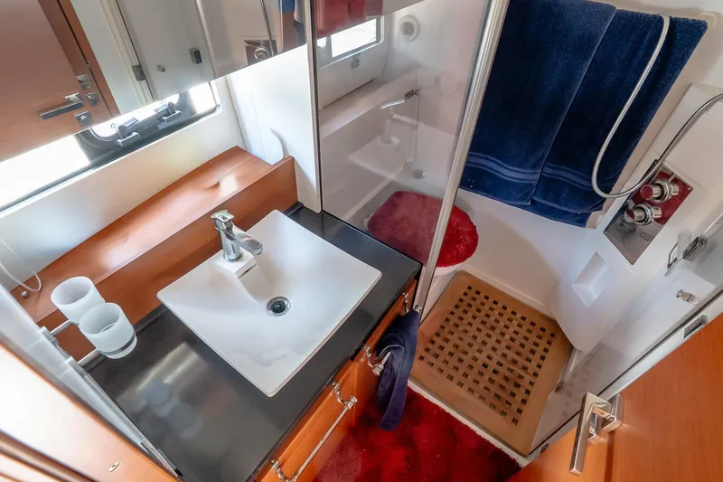 Slide: The Image of Luxurious bathroom in 2015 Prestige 450S yacht with modern sink and shower. - 34