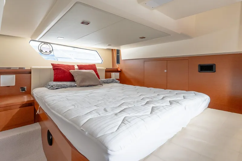 Slide: The Image of Luxurious cabin interior of 2015 Prestige 450S yacht with cozy bedding and modern design. - 26