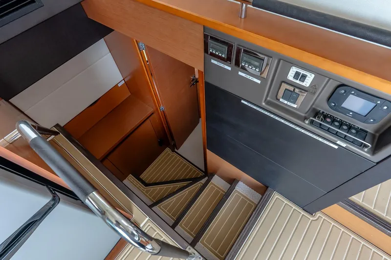Slide: The Image of Interior stairs and control panel of a 2015 Prestige 450S yacht. - 17