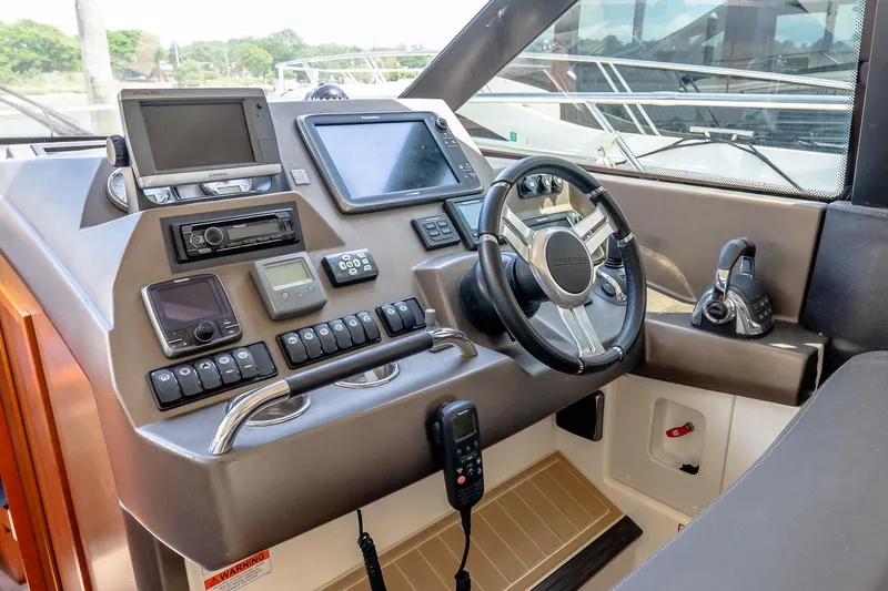 Slide: The Image of Control panel of a 2015 Prestige 450S yacht with advanced navigation systems. - 23