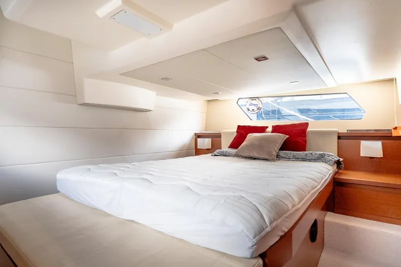 Slide: The Image of Luxurious cabin interior of a 2015 Prestige 450S yacht with a comfortable bed. - 25