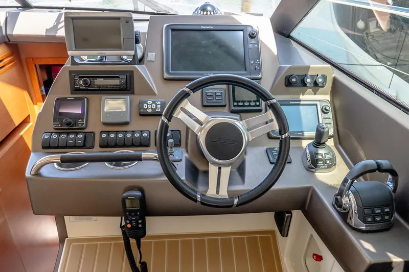 Slide: The Image of Control panel of a 2015 Prestige 450S yacht with advanced navigation systems. - 24