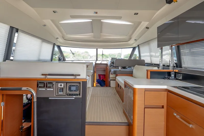 Slide: The Image of Luxurious interior of a 2015 Prestige 450S yacht with modern amenities and sleek design. - 16