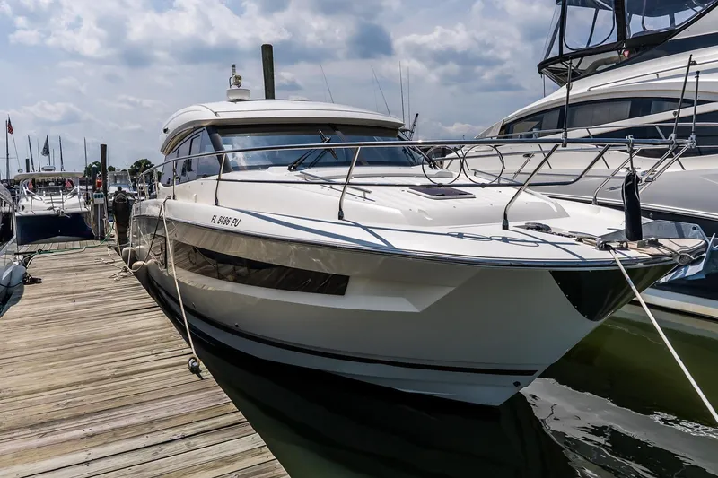 The Image of 2015 Prestige 450S yacht docked at marina under cloudy sky. - 0