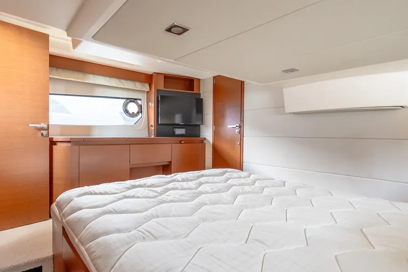 Slide: The Image of Luxurious cabin interior of 2015 Prestige 450S yacht with bed and TV. - 27