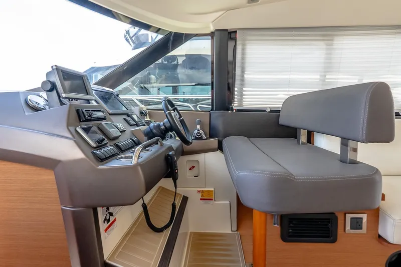 Slide: The Image of Interior helm of 2015 Prestige 450S yacht with modern controls and seating. - 22