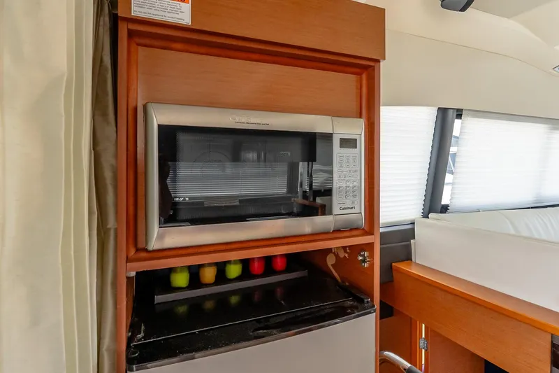 Slide: The Image of Modern kitchen area in 2015 Prestige 450S yacht with microwave and storage. - 15