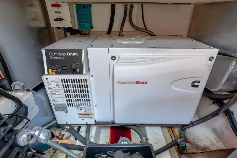 Slide: The Image of Cummins Onan generator in a 2015 Prestige 450S yacht engine room. - 37