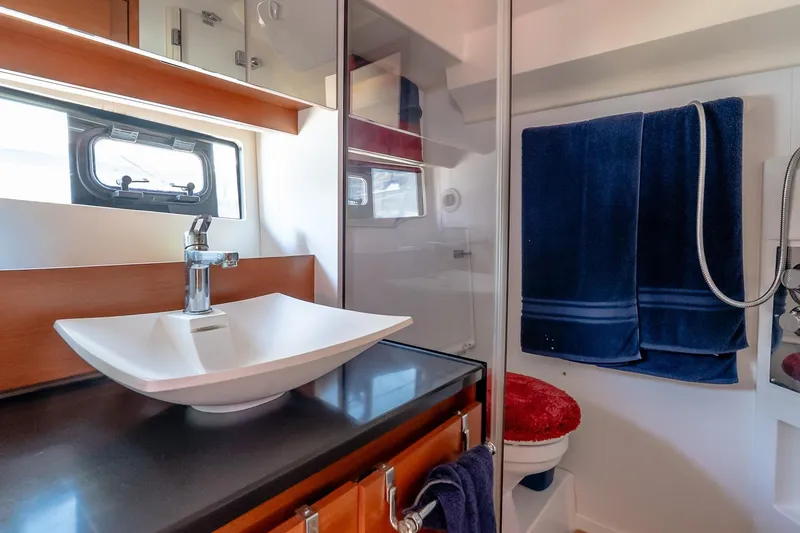 Slide: The Image of Luxurious bathroom in 2015 Prestige 450S yacht with modern sink and blue towels. - 35