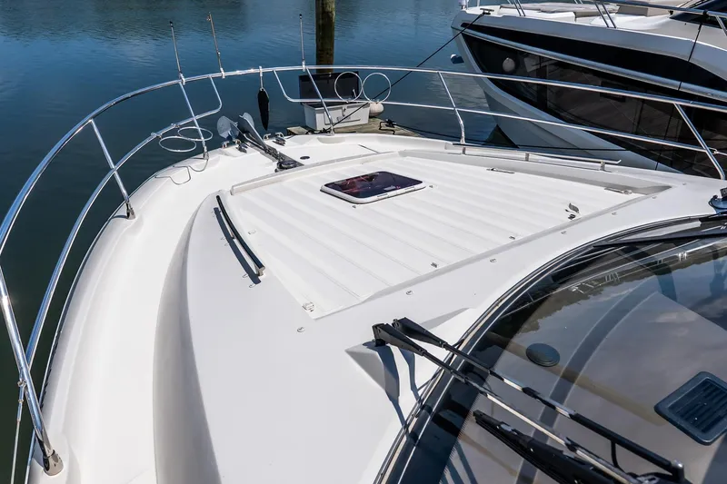 Slide: The Image of 2015 Prestige 450S yacht deck with sleek design and modern features, docked at marina. - 42