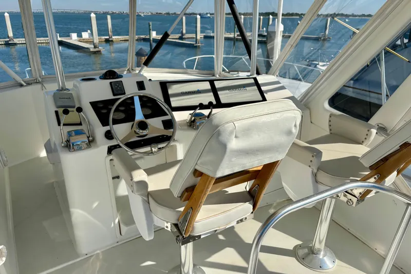 Slide: The Image of 1999 Ocean Yachts 45 Super Sport helm with steering wheel and navigation equipment. - 22