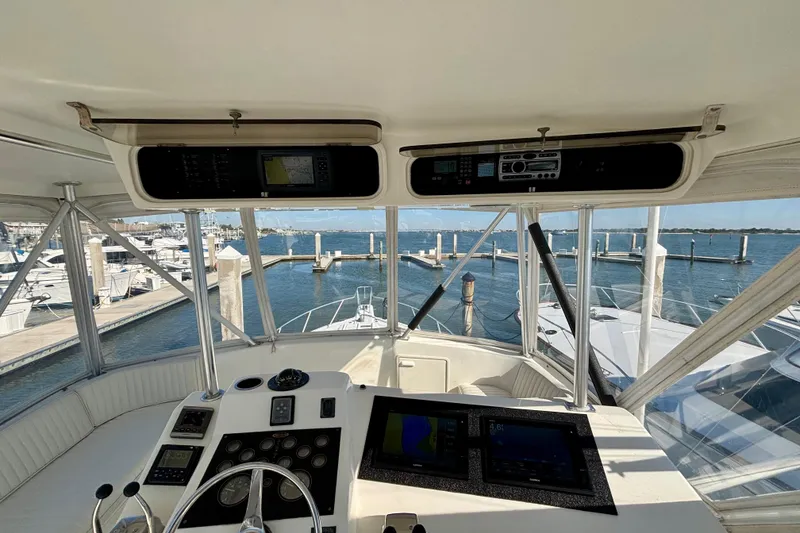 Slide: The Image of Cockpit view of a 1999 Ocean Yachts 45 Super Sport at a marina. - 23