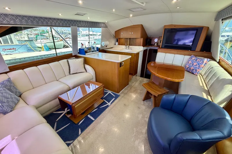 Slide: The Image of Luxurious interior of a 1999 Ocean Yachts 45 Super Sport with plush seating and modern amenities. - 9
