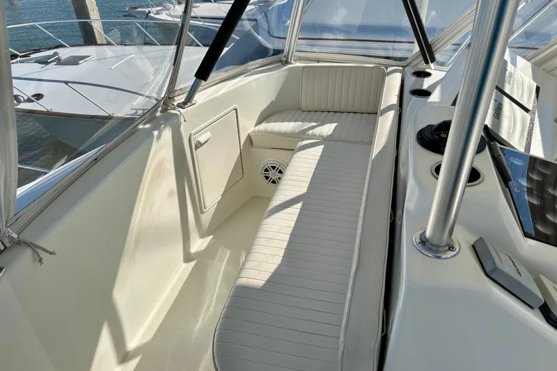 Slide: The Image of Interior view of 1999 Ocean Yachts 45 Super Sport with cushioned seating and control panel. - 25
