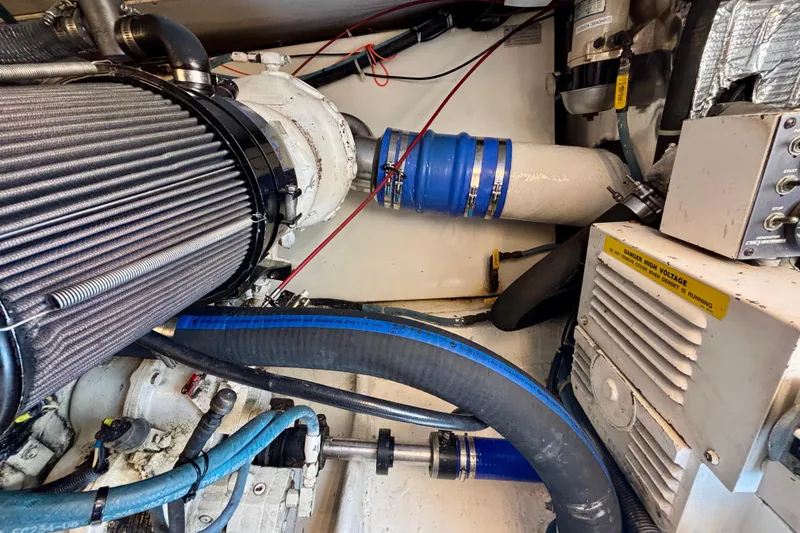 Slide: The Image of Engine room of a 1999 Ocean Yachts 45 Super Sport, showcasing mechanical components. - 30