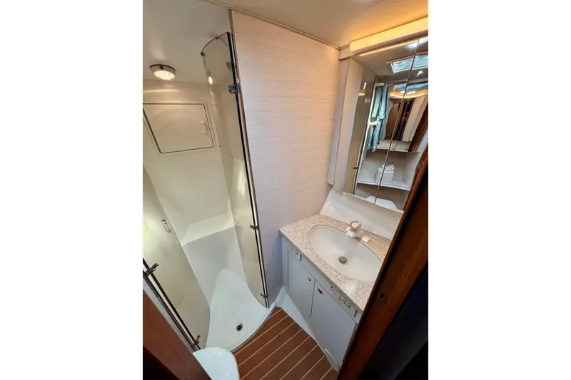 Slide: The Image of Bathroom interior of 1999 Ocean Yachts 45 Super Sport with shower and vanity. - 18