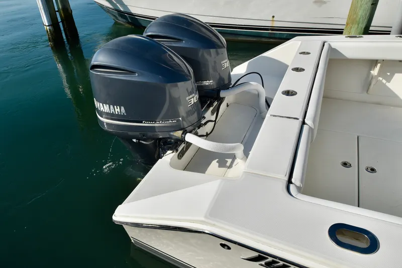 Slide: The Image of A 2015 Jupiter Center Console boat with twin Yamaha outboard engines in the water. - 29