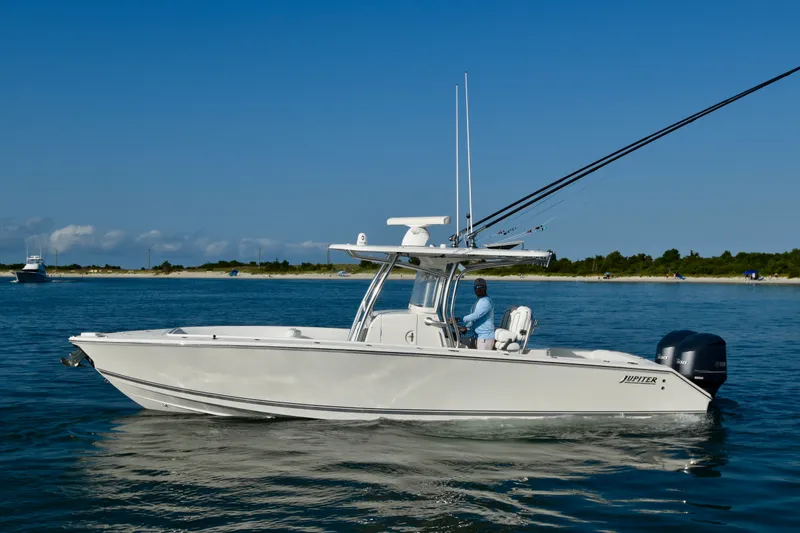 Slide: The Image of 2015 Jupiter Center Console on calm water with an angler on board. - 4