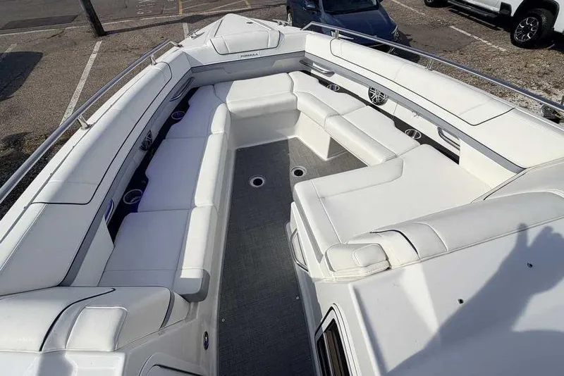 Slide: The Image of 2022 Formula 330 Crossover Bowrider I/O with spacious white seating and sleek design. - 42