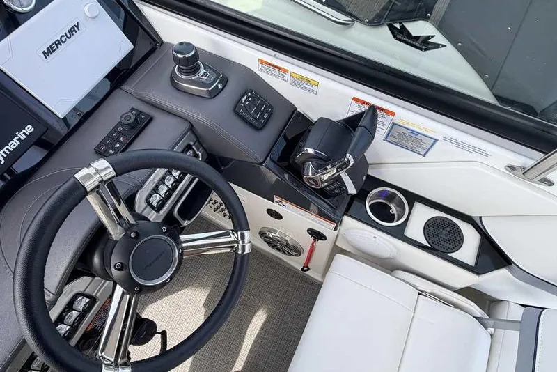 Slide: The Image of Cockpit of 2022 Formula 330 Crossover Bowrider I/O with steering wheel and controls. - 31