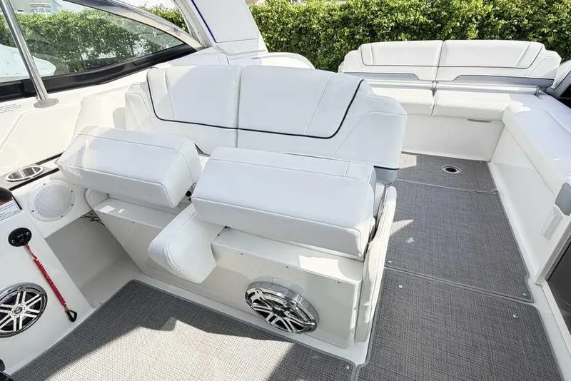 Slide: The Image of 2022 Formula 330 Crossover Bowrider I/O interior with luxurious white seating and modern design. - 26