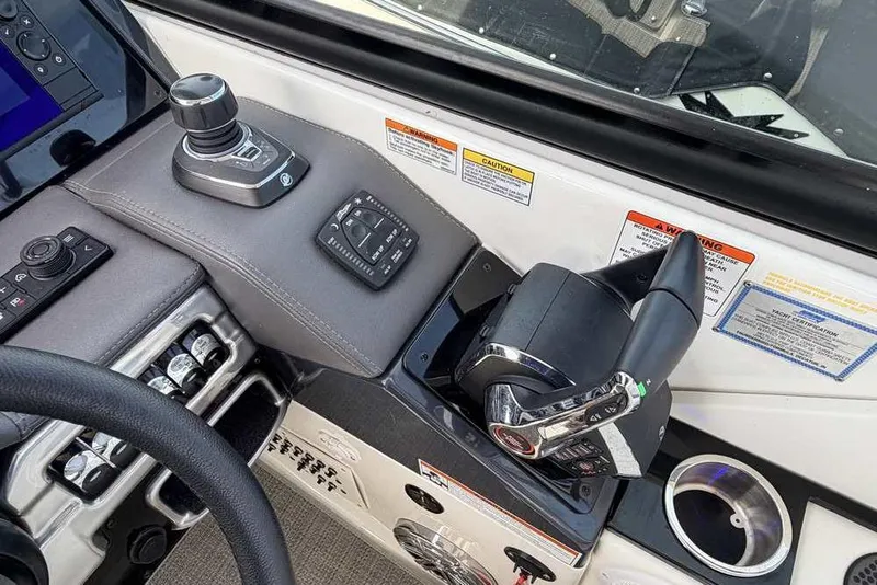 Slide: The Image of Control panel of 2022 Formula 330 Crossover Bowrider I/O with joystick and throttle. - 32