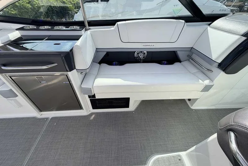 Slide: The Image of 2022 Formula 330 Crossover Bowrider I/O interior with sleek seating and modern design. - 18