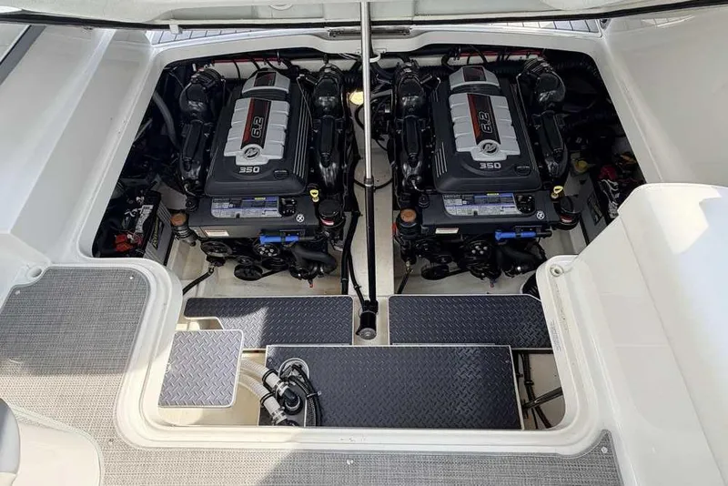 Slide: The Image of Engine compartment of 2022 Formula 330 Crossover Bowrider I/O with twin 350 engines. - 58