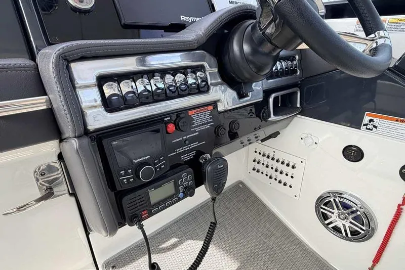 Slide: The Image of 2022 Formula 330 Crossover Bowrider I/O dashboard with steering wheel and control panel. - 34