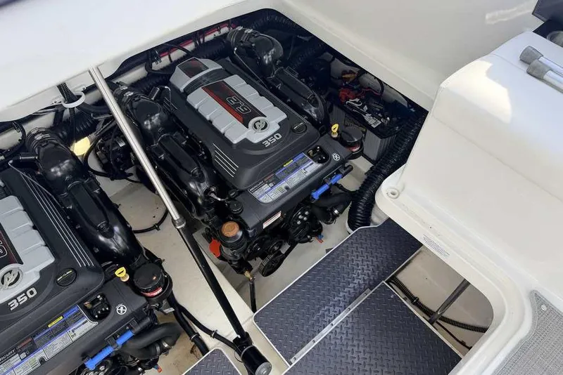 Slide: The Image of Engine compartment of 2022 Formula 330 Crossover Bowrider I/O with twin 350 engines. - 60