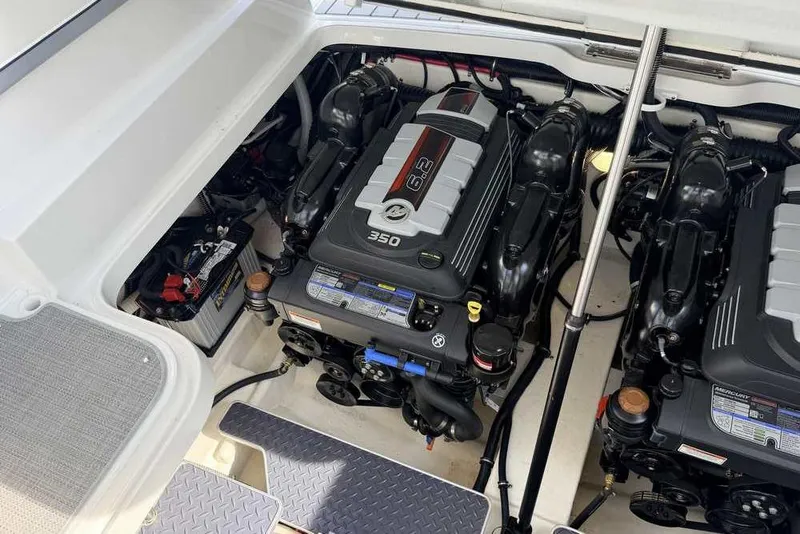 Slide: The Image of Engine compartment of a 2022 Formula 330 Crossover Bowrider I/O, featuring dual 6.2L engines. - 59